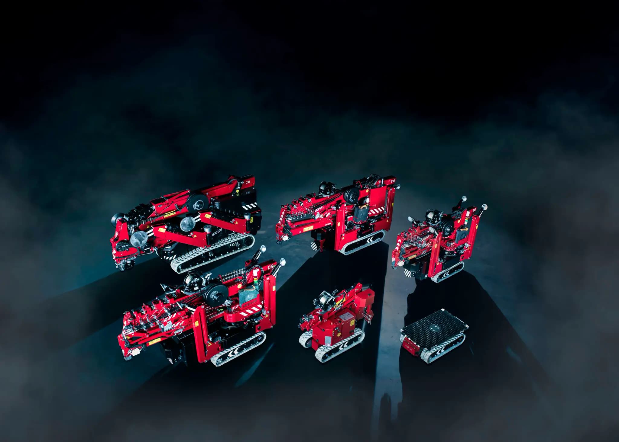 Image des grues compactes Hoeflon et d’un transporteur.