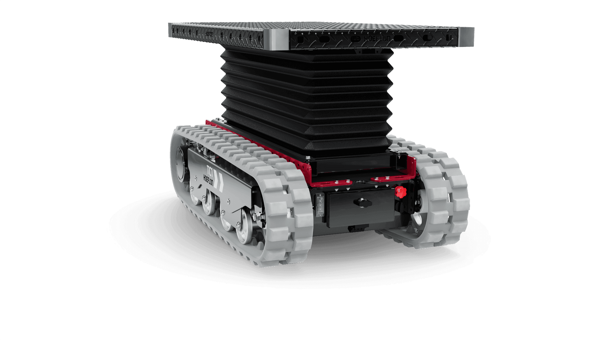 Véhicule à chenilles TC1 avec plateforme étendue pour système de levage.